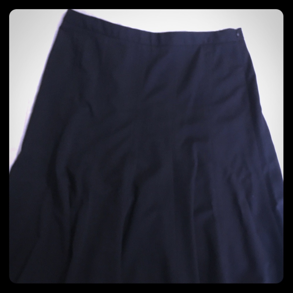 Black knee length skirt.